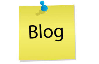 A yellow post it note with the word blog on it.