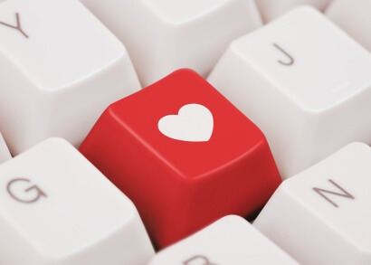 A red heart on a computer keyboard.