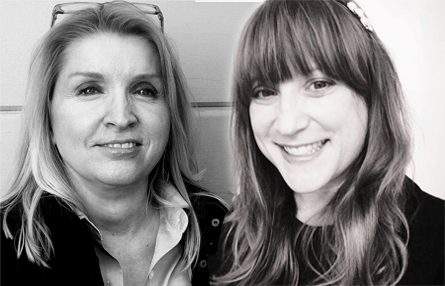 Two women standing next to each other in a black and white photo.