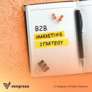 Open notebook with a pen in the middle and one of the pages say B2B Marketing Strategy