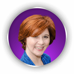 Debra Eckerling, a woman with red hair, smiling on a purple background.