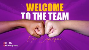 Two fists, one dark-skinned and one light-skinned, bump together in front of a vibrant purple background. Bold yellow and white text reads: “WELCOME TO THE TEAM.” Script below welcomes new hires. Social media handles appear in the bottom left corner.
