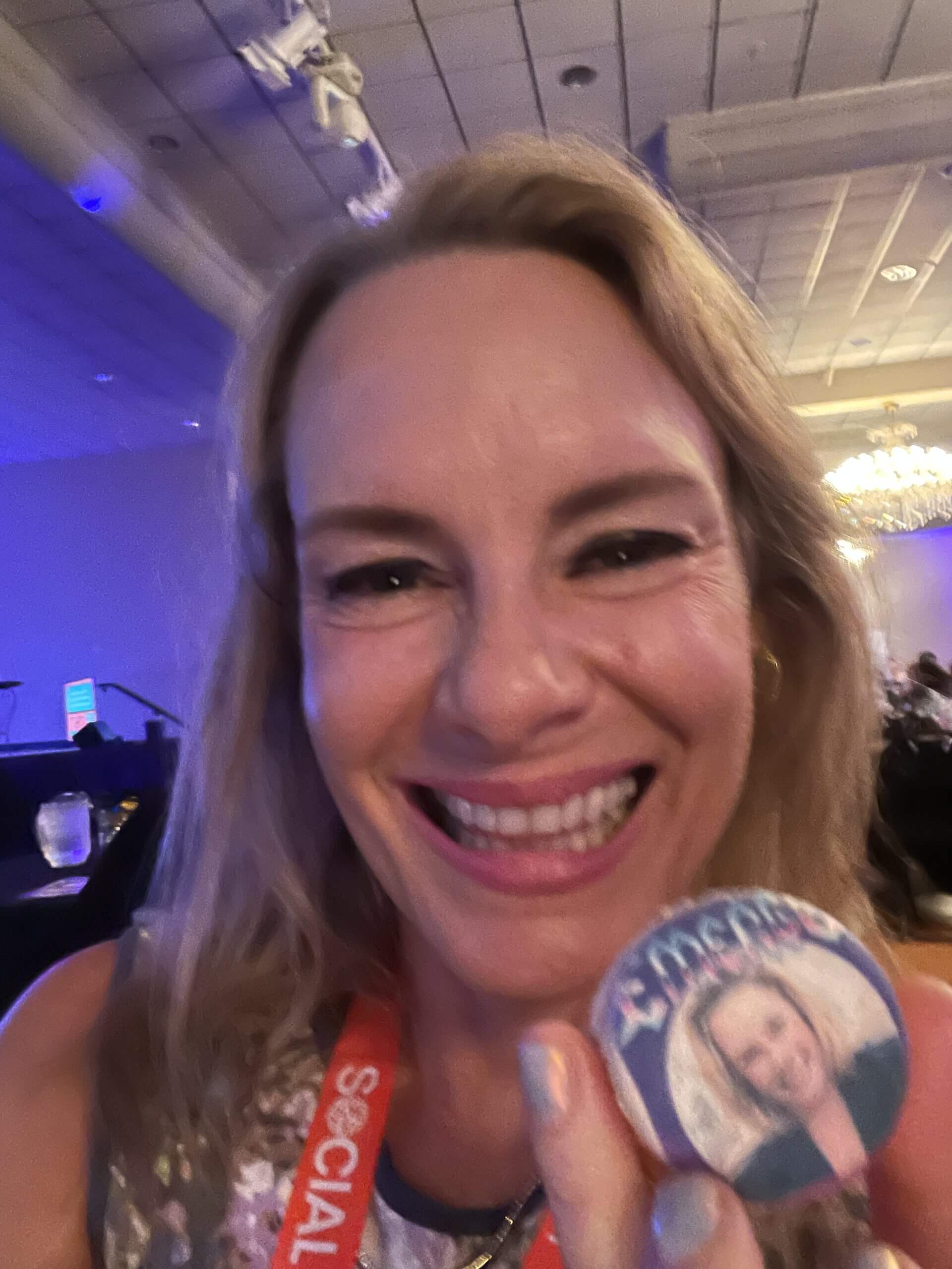 Woman smiling viveka von rosen with a cookie personalized with her face on it