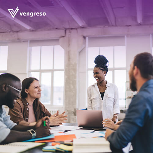 sales people gathered in a business meeting