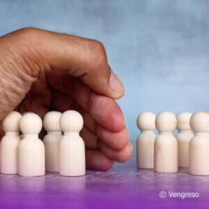 a close up of a hand covering a group of pawns and separating from another group