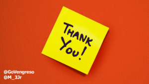 A bright yellow sticky note with the text "thank you email" written in bold, black marker, attached to a vivid orange wall. Twitter handles "@govengreso" and "@m_3jr