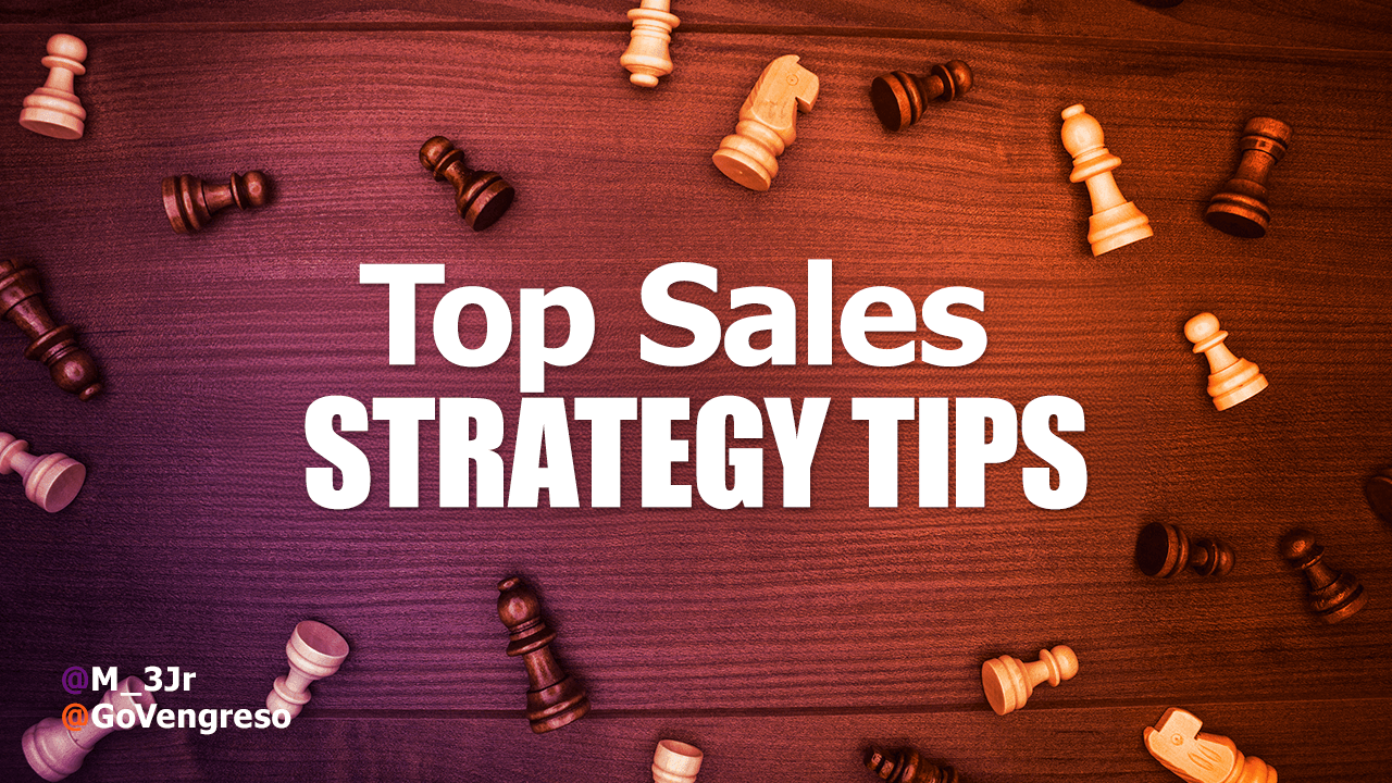 Text 'Top Sales Strategy Tips' in white font centered on a wooden surface background. Scattered around the text are chess pieces in light and dark wood, symbolizing strategic thinking essential for successful sales strategies. Two social media handles are visible in the bottom left corner.