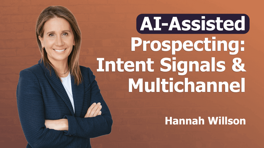 A woman with light brown hair in a navy blazer and white shirt stands smiling with folded arms. The text reads: "AI-Assisted Prospecting: Intent Signals & Multichannel. Hannah Willson" on a gradient orange background, highlighting intent signals.