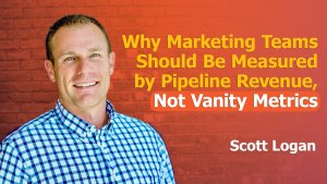 A smiling man in a blue-and-white checkered shirt stands against a red brick wall. Next to him, bold yellow and white text reads: “Why Marketing Teams Should Be Measured by Pipeline Revenue, Not Vanity Metrics.” Featuring the measure marketing by pipeline revenue podcast with Scott Logan.